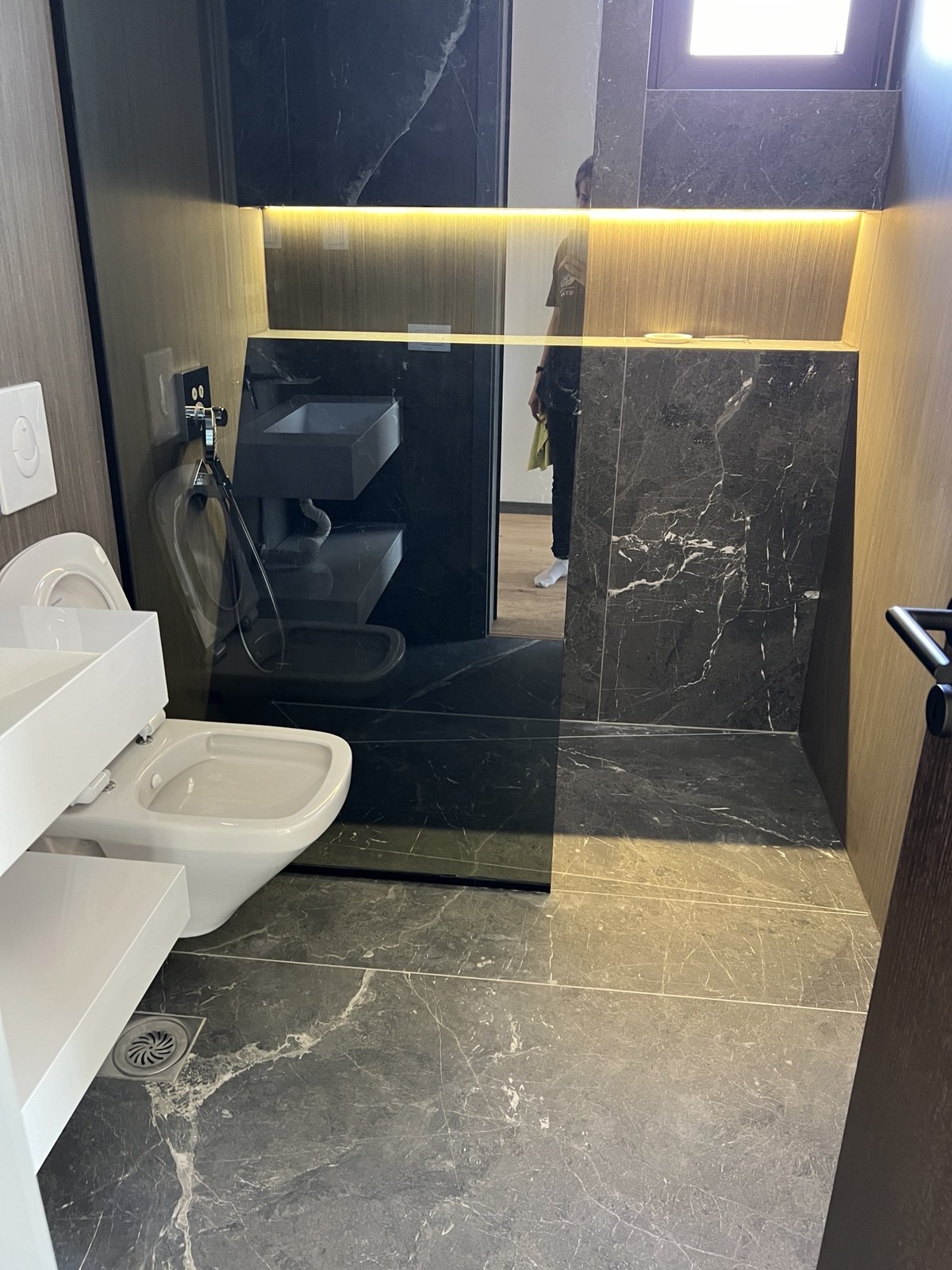 Dark marble bathroom after detailed cleaning
